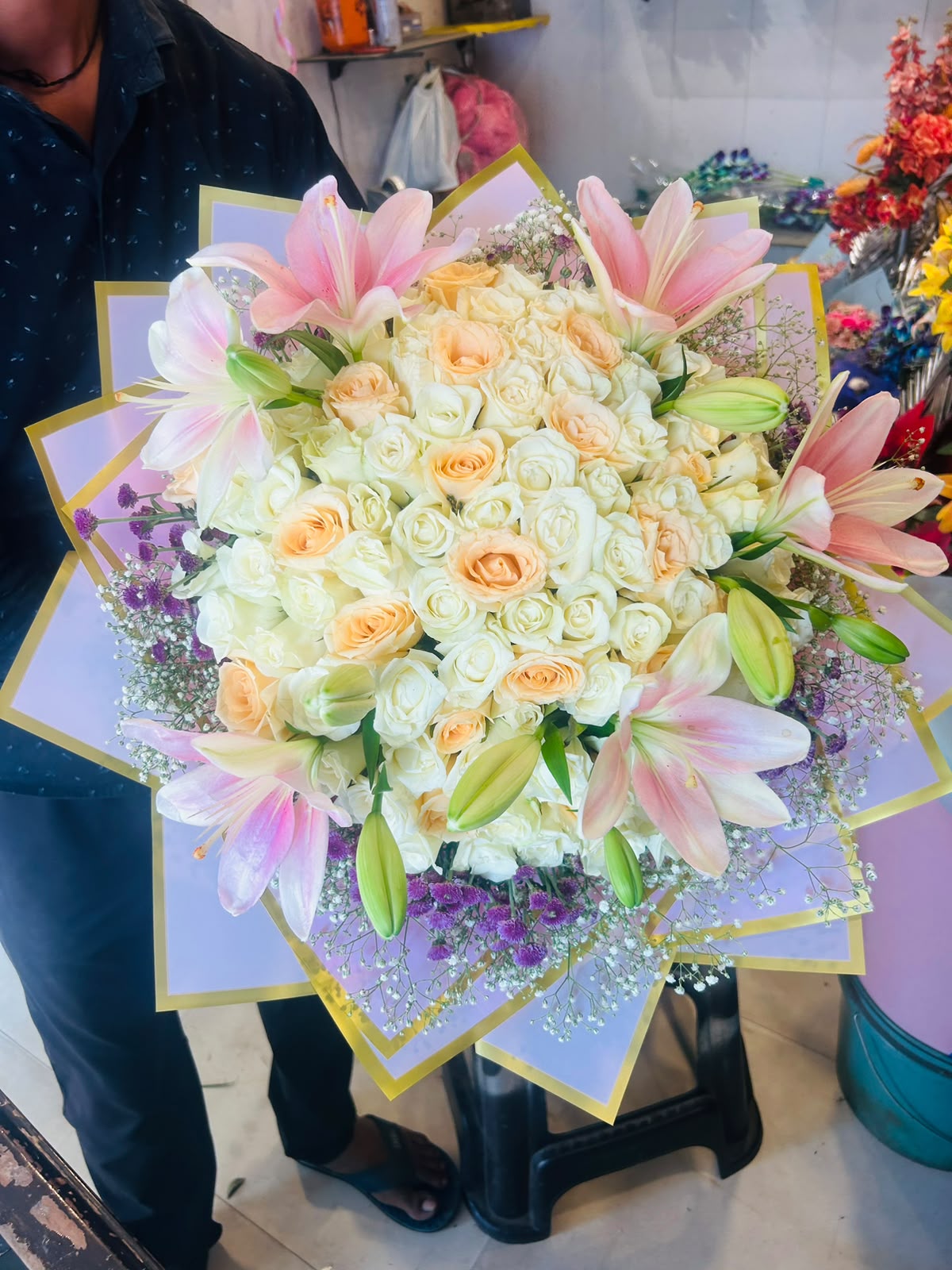 Fresh rose and pink lily Karwa Chauth bouquet in lilac wrapping for Ghaziabad delivery