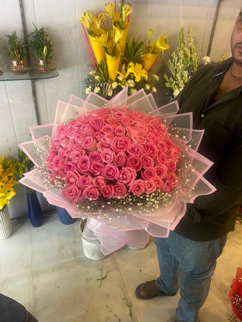Full-size pink rose bouquet in layered blush wrapping