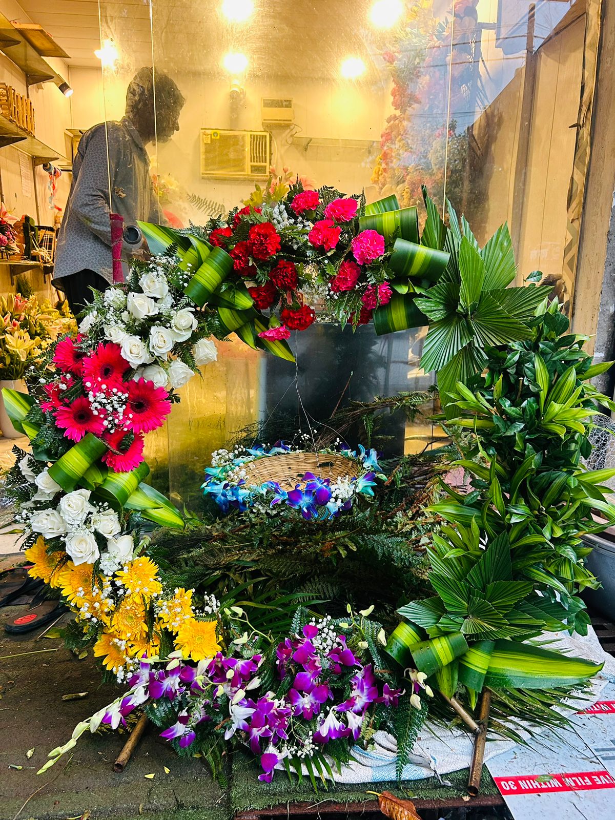 Colourful orchid rose and gerbera Krishna jhula flower decoration for an Indirapuram home temple